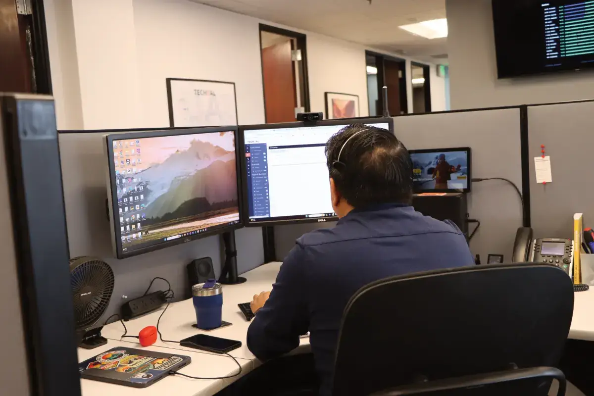 Techital employee at work station completing work on Techital dashboard